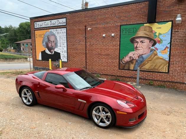 C6 Corvette at two brick murals