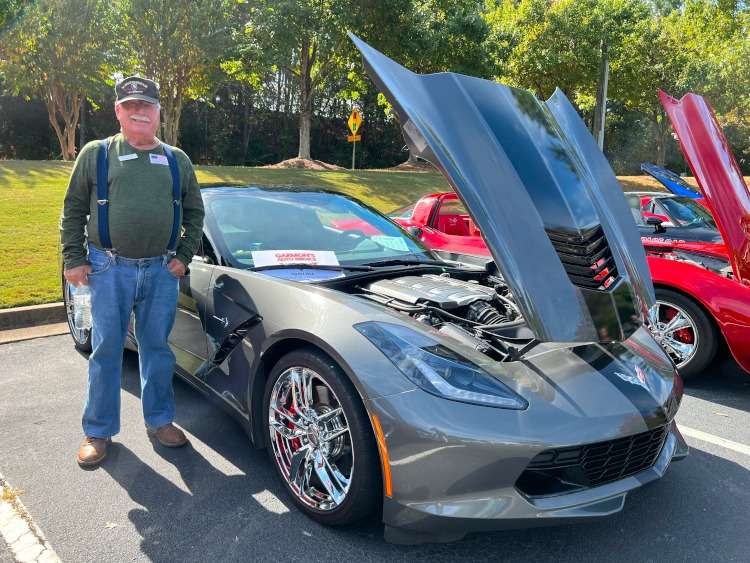 C7 grey Corvette with a black racing stripe
