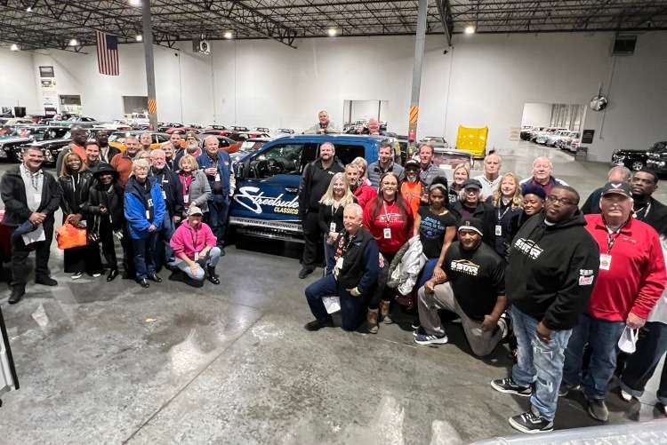 A group of people inside a storage facility