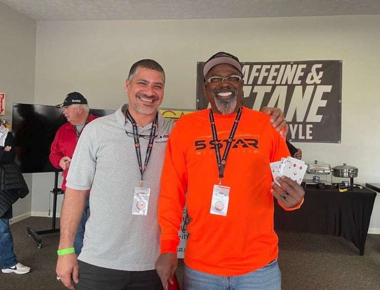 Two people smiling.