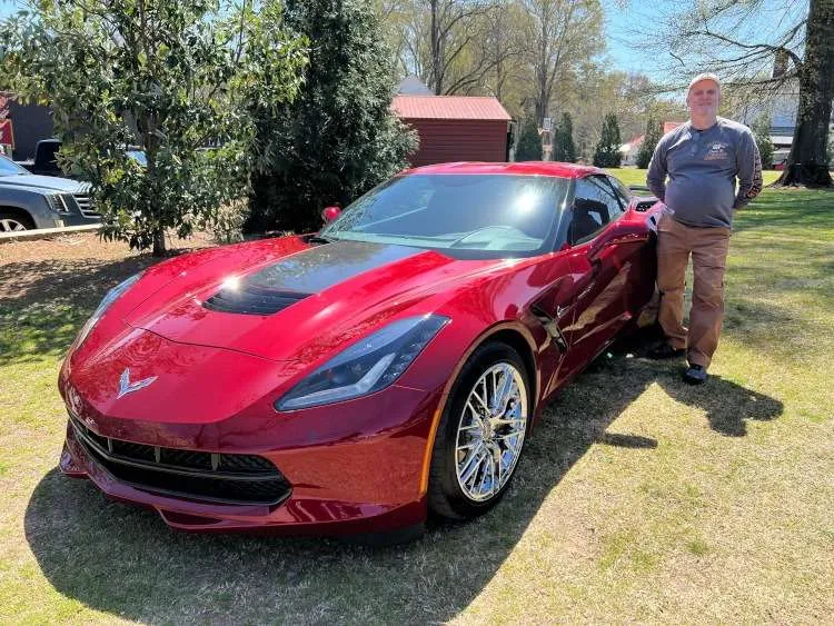A crystal red Corvette coupe.