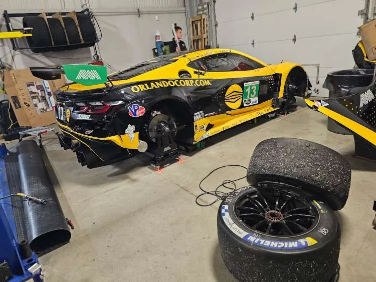 A Corvette racecar with the wheels off