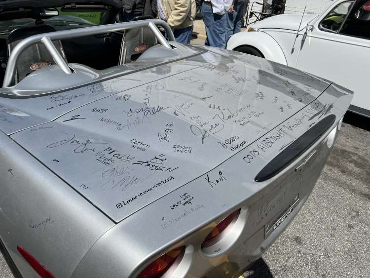 Signatures on the deck of a C6 Corvette.