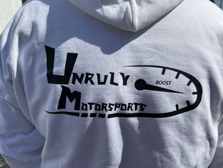 The logo for Unruly Motorsports
