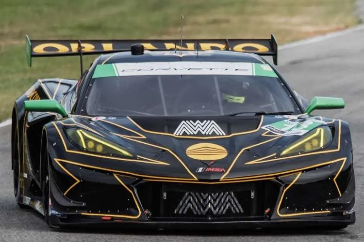 A head-on close-up of the black and gold #13 AWA Corvette Z06 GT3.R race car at VIR.