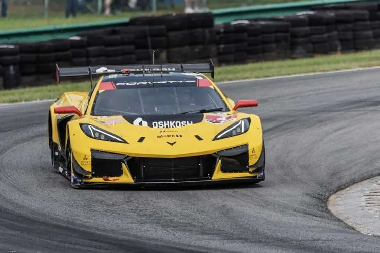 A head-on, low-angle view of the winning #3 Corvette Z06 GT3.R in a corner at the VIR race.