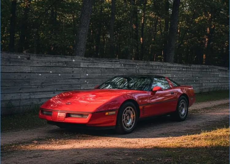 C4 Corvette parked near the woods in the setting sun. Image used in Vettes of Atlanta Magazine.