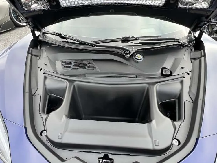 Full view of the open front trunk (frunk) and specialized cooling radiator on a Hysteria Purple 2025 Corvette ZR1.