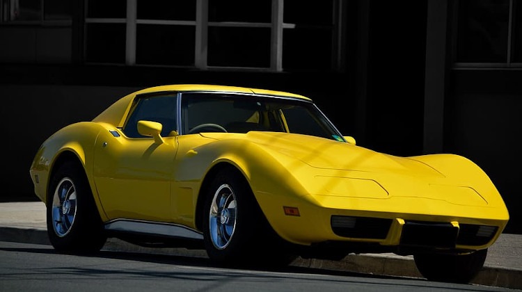 Bright yellow third generation Corvette coupe