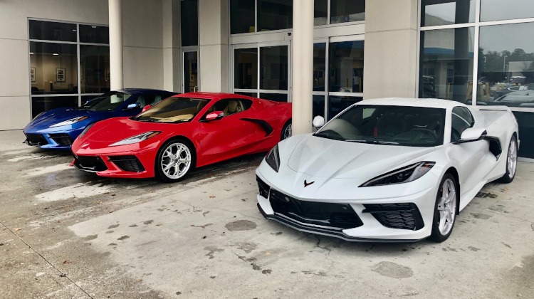 An Artic White, Torch Red, and Elkhart Lake Bue C8 Corvettes