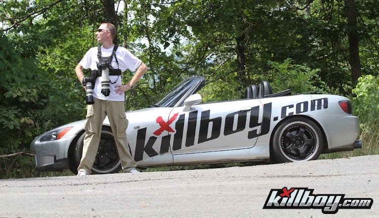 Photographer from Killboy.com beside car