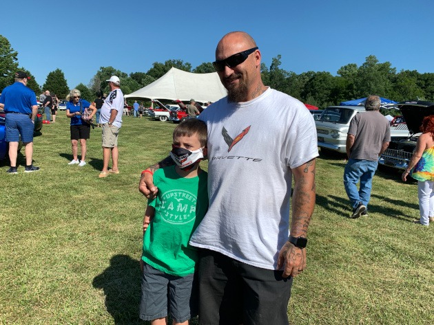 A member of the CCA Corvette club with his son