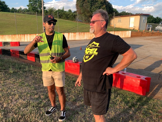 Lanier Raceplex track official giving pointers