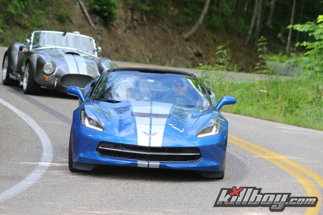 Blue C7 Corvette with silver racing stripes