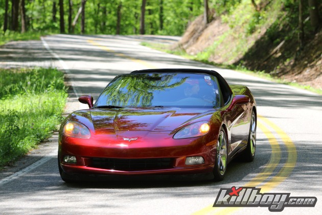 Red Corvette coupe on a twisty road