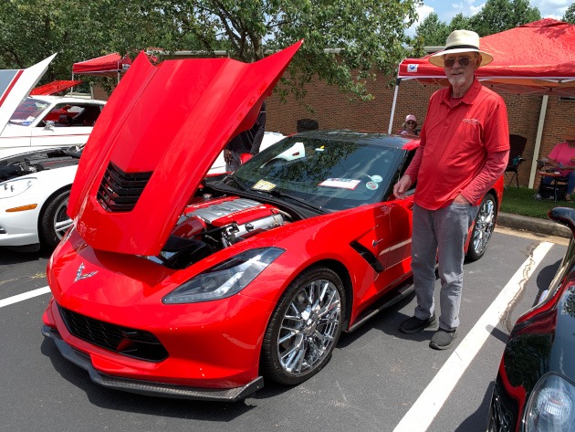 Torch Red C7 Corvette coupe at a car show
