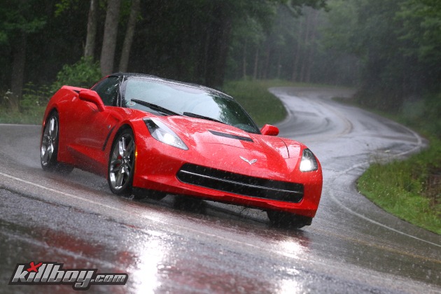 Seventh-generation Corvette coupe on twisty, rainy road