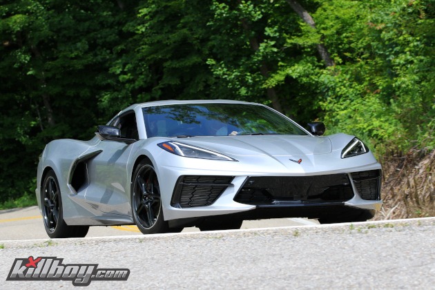 Silver C8 Corvette coupe on twisty road