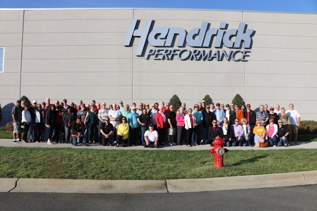 Corvette enthusiasts in front of Hendrick Performance