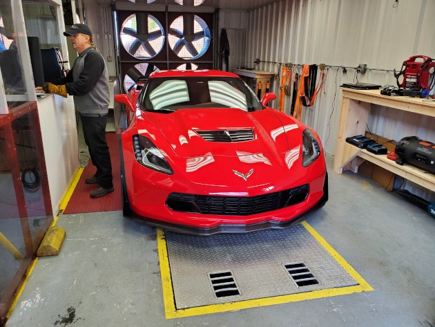 Seventh-generation Torch Red Corvette at rolling dyno