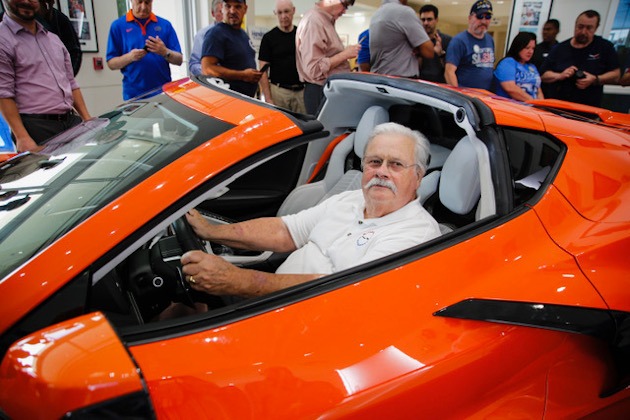Man sitting in a eighth-generation Corvette