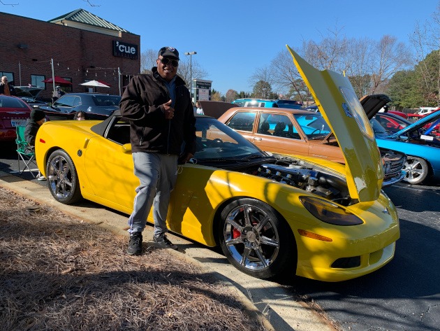 C6 yellow Corvette at a car show