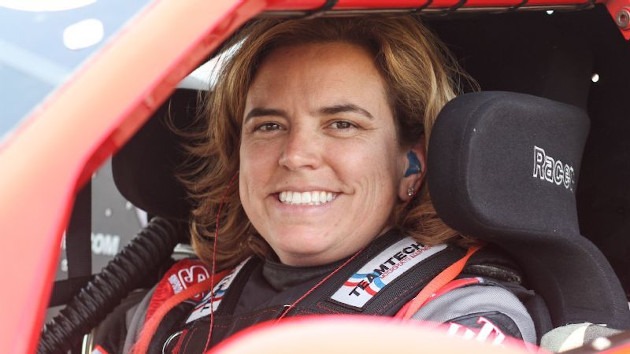 Amy Ruman inside the cockpit of race Corvette