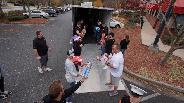Volunteers loading the Vengeance racing trailer