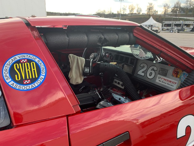 SVRA sticker on the B pillar of a red Corvette