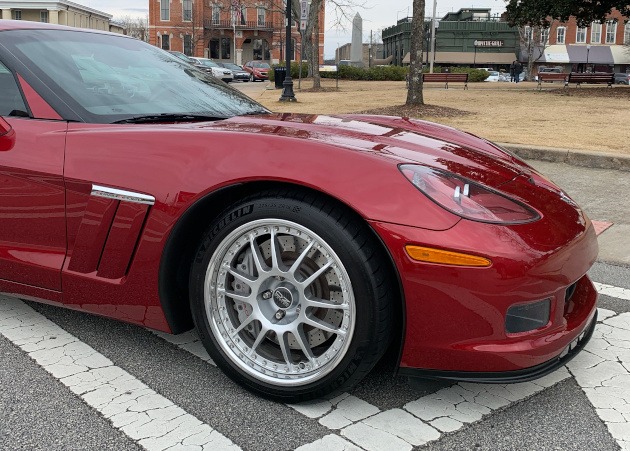 OZ Racing rims on a crystal red Corvette
