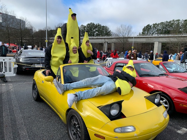 Young men dressed like bananas at the car show