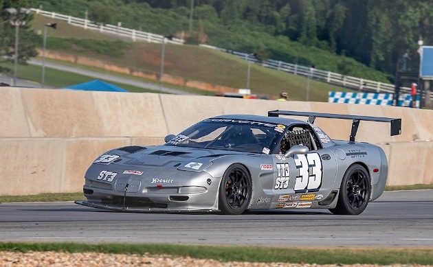 Silver Fifth-generation Corvette race car on the track