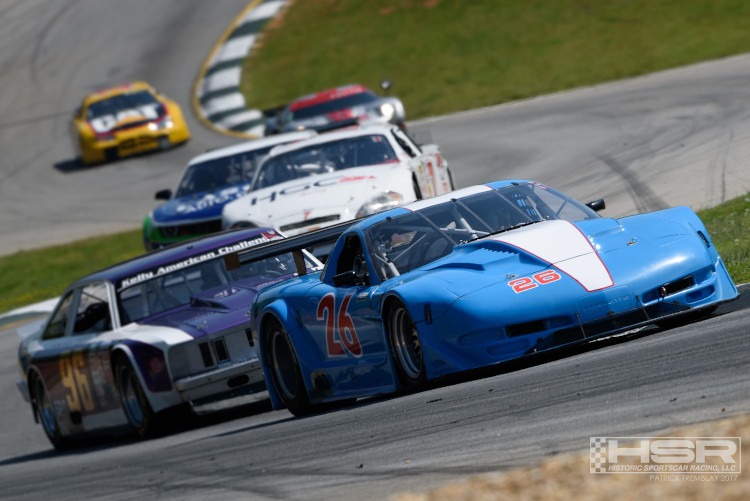 Fifth-generation Corvette racecar leading the field on a race course