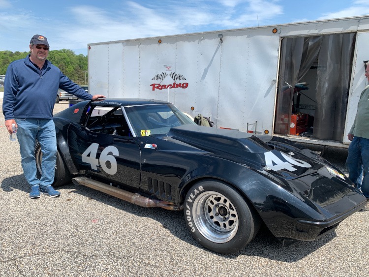 Third-generation black Corvette race car with side pipes