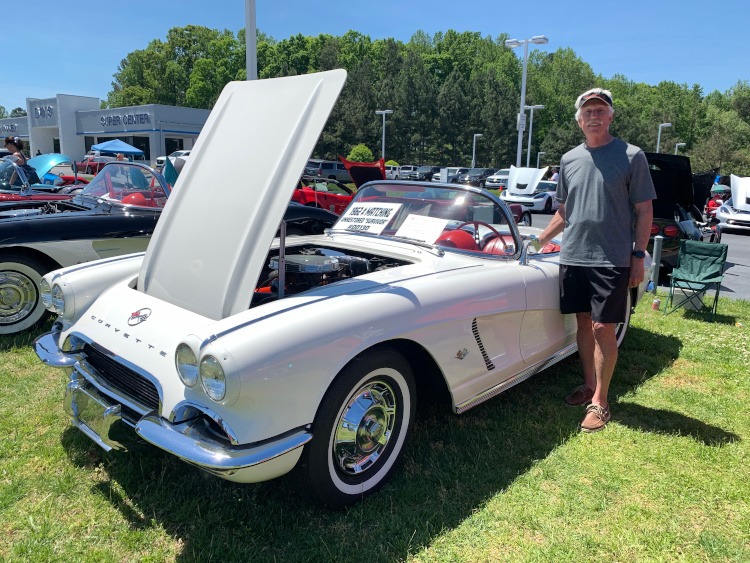 First-generation Ermine White Corvette convertible at car show