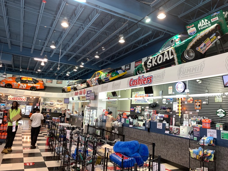 Race cars over head inside the Summit Racing showroom