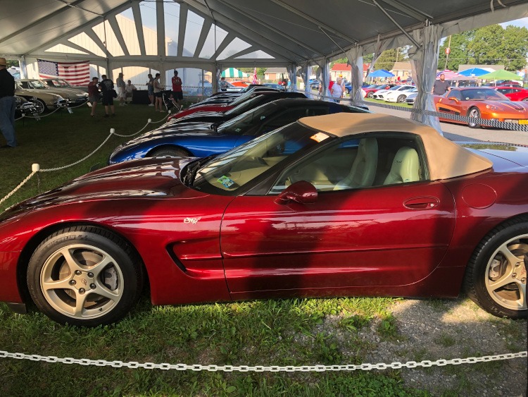 Several show quality fifth-generation Corvettes parked at Carlisle car show