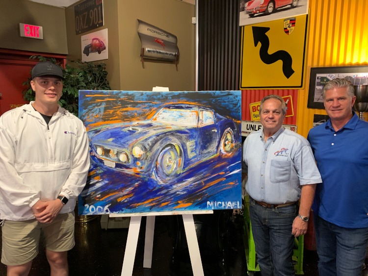three men near car painting