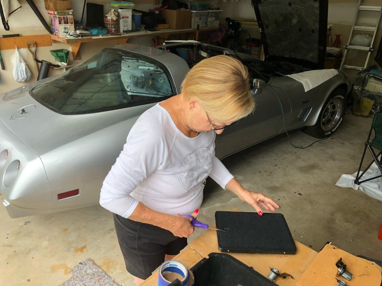 Installing the cubby covers for a 1978 Corvette