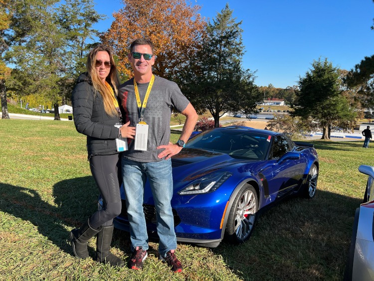Owners standing by their C7 Z06 model Corvette coupe