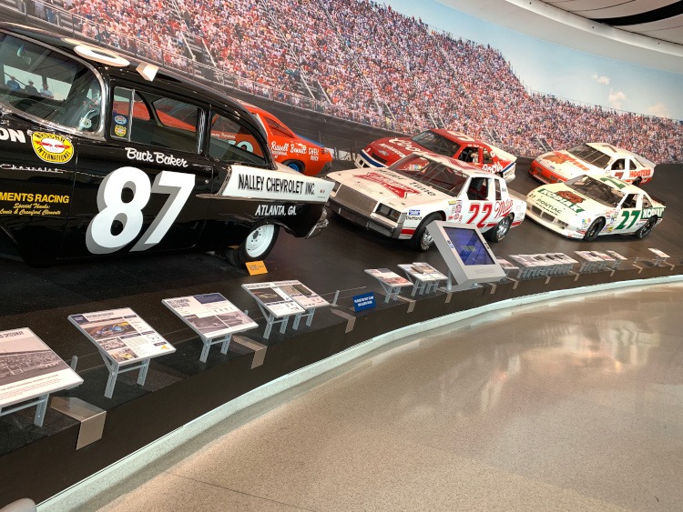 Famous stock cars at the NASCAR Hall of Fame.