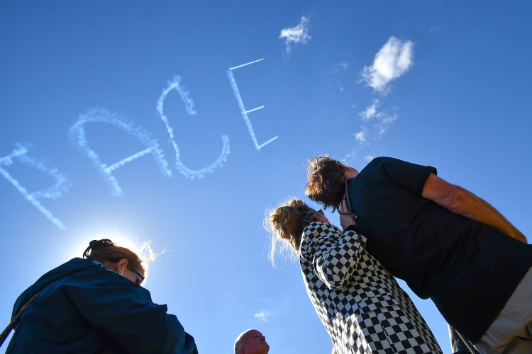 skywriter spelling out the word PACE