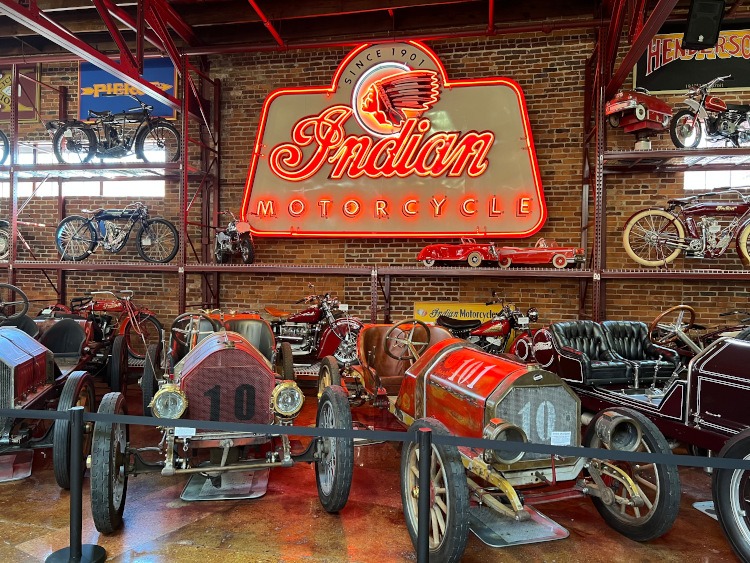 Vintage cars & motorcycles with neon Indian Motorcycle lsign