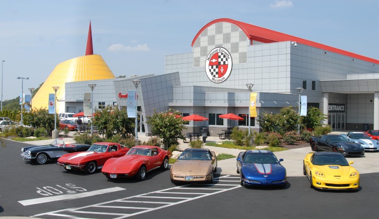 Different generations of Corvettes parked outside of the NCM