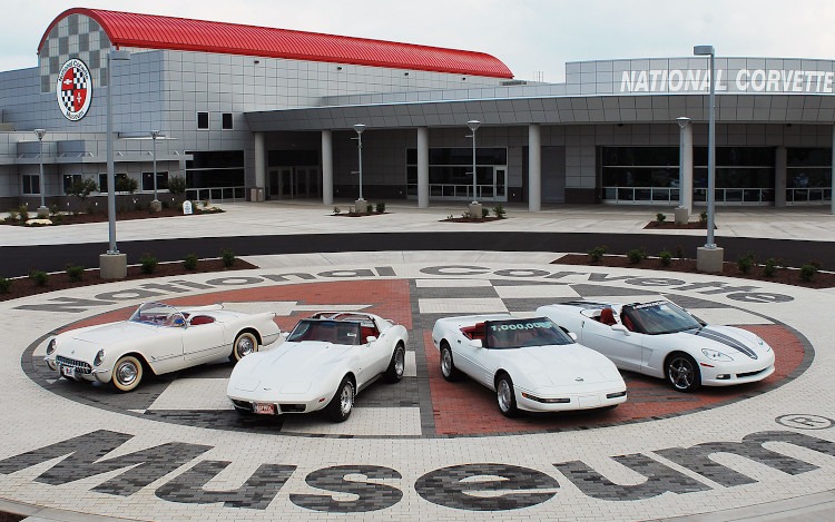 White Corvettes parked outside the National Corvette Museum