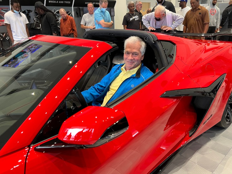 Man sitting in an eighth-generation Z06 edition Corvette
