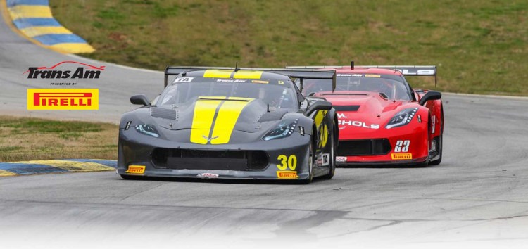 Two Corvettes racing on a road course