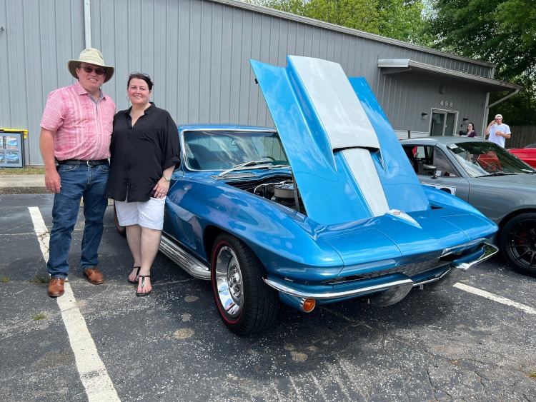 Second-generation blue Corvette coupe with side pipes
