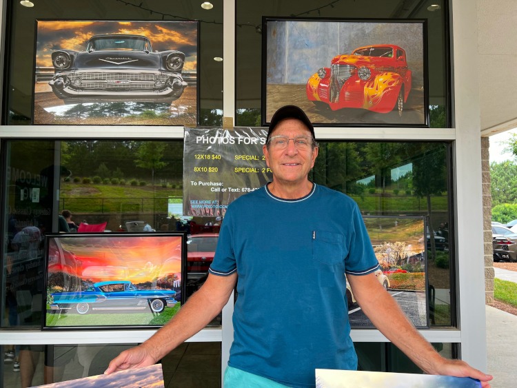 Jeffrey Lorber with examples of his automobile artwork
