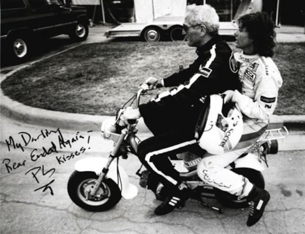 Paul newman and Lyn St. James on motor scooter
